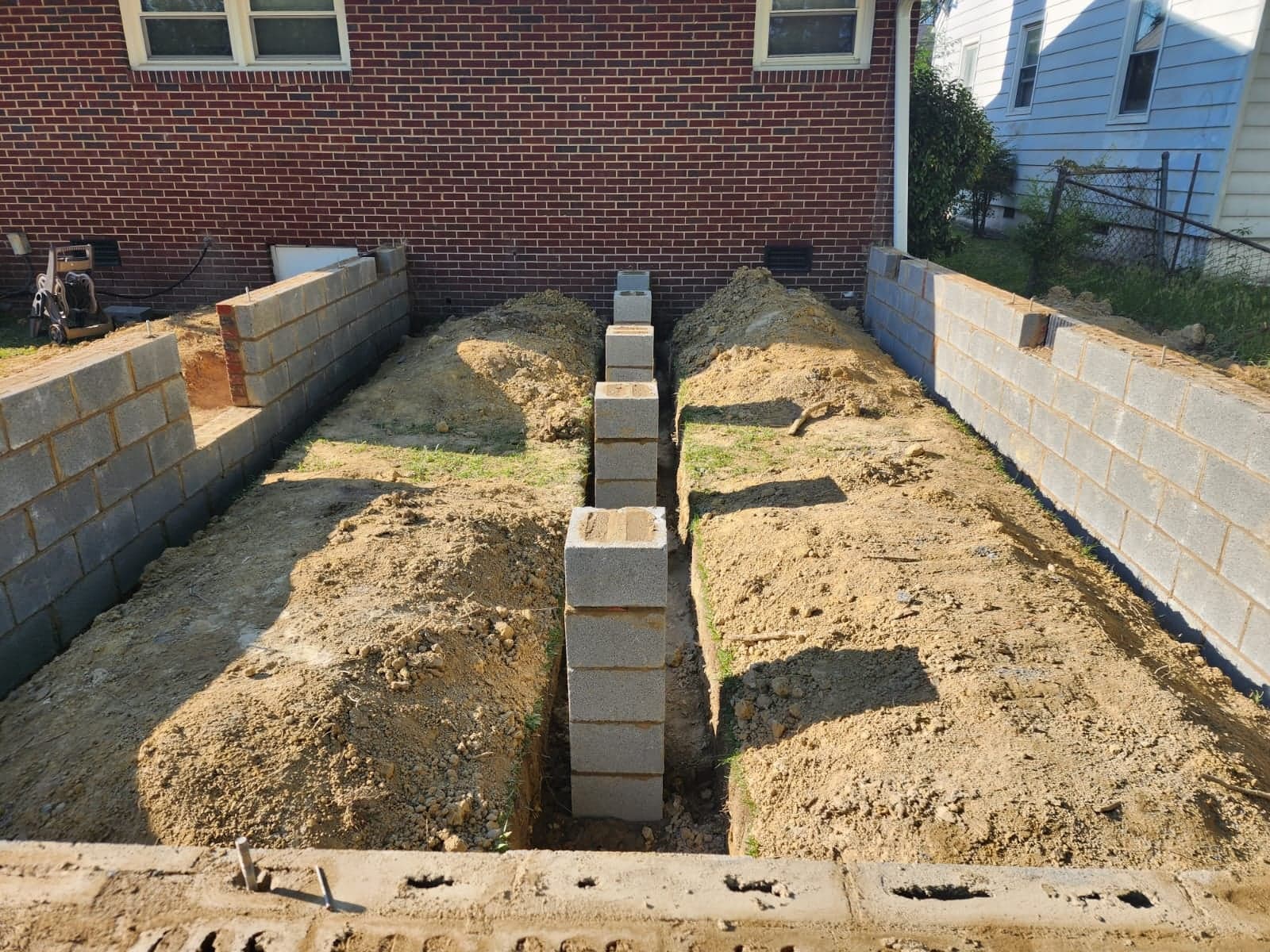 Footing trench and foundation block piers for a home addition in Richmond, VA by MAS Contractors