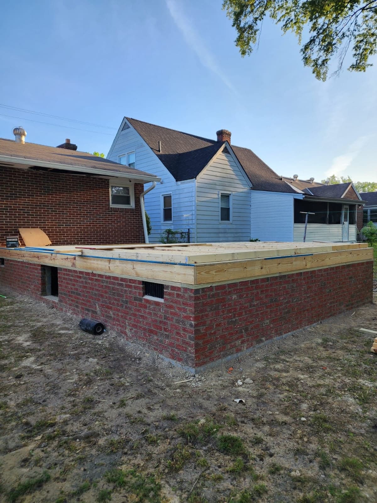 New brick foundation and floor framing for a room addition in North Chesterfield, VA by MAS Contractors