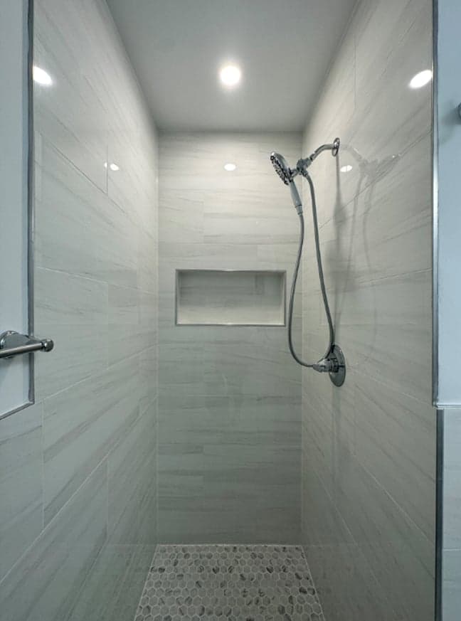 Tile installation detail by MAS Contractors in North Chesterfield, VA — herringbone pattern